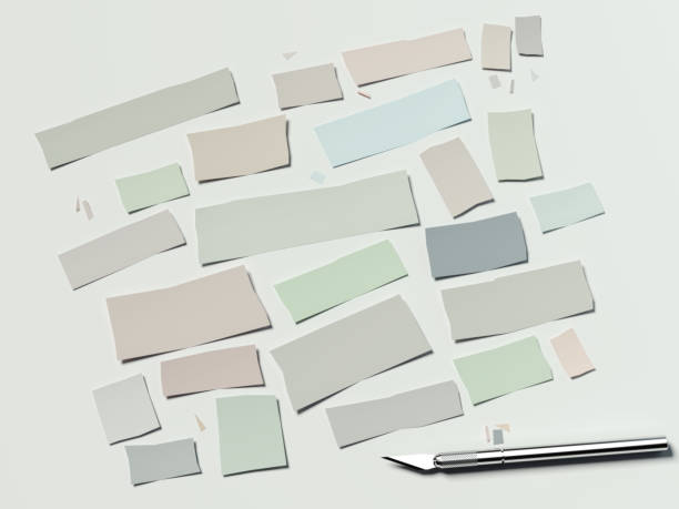 istock Colored cutted paper and scalpel on a white background. 3d rendering 654999644
