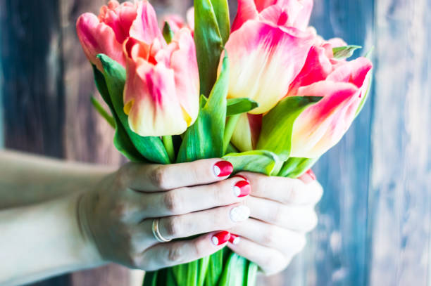 istock Still life with tulips on the wooden pattern 655004542