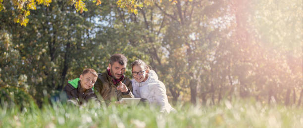 istock Father and his sons enjoying in nature 655004828