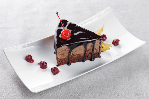 istock Piece of chocolate cake on a white plate 655015144