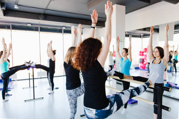 istock Group of girls doing stretching exercise 655015388