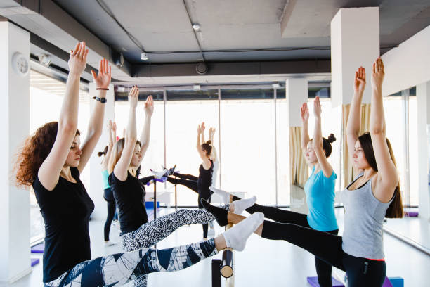 istock Group of girls doing stretching exercise 655015448