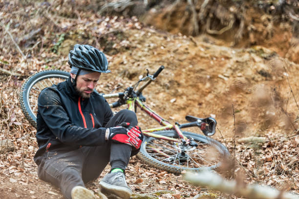 istock Young man fell off mountain bike 655019470