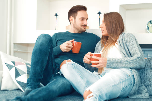 istock Happy young couple relaxing at home 655026220