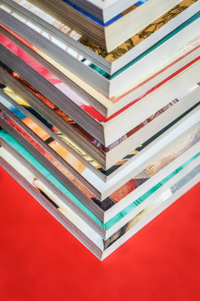 istock stacked books on red background top view 655044330