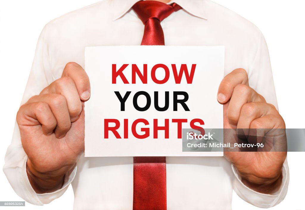 Man holding a card with a text Know Your Rights Expertise Stock Photo