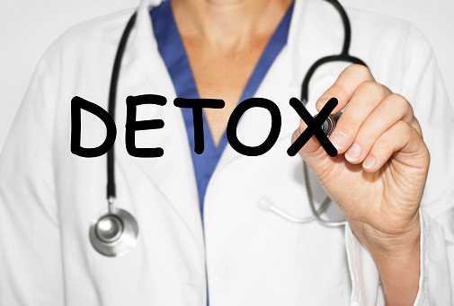 Doctor writing word Detox with marker, Medical concept