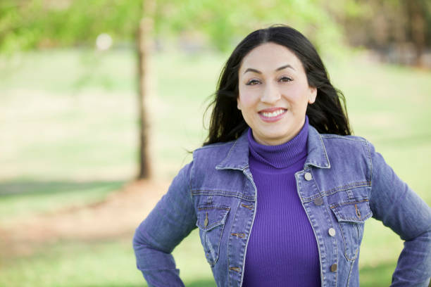 istock One Latin descent woman outdoors in park. 655053588
