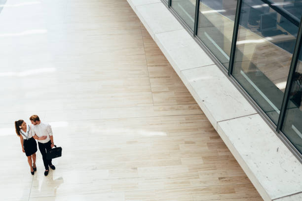 istock Business couple walking together. Top view 655065862