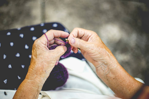 istock Older woman outdoors knits 655066356