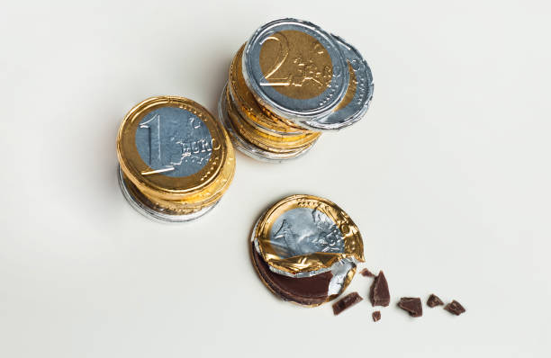 istock Stacked chocolate euro coins, investment concept 655087292