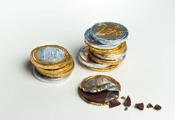 istock Stacked chocolate euro coins, investment concept 655087368