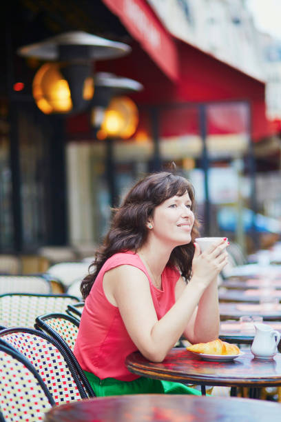 istock Woman drinking coffee in cafe 655088176