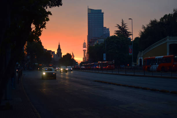 istock Avenue in town at dusk. 655088334
