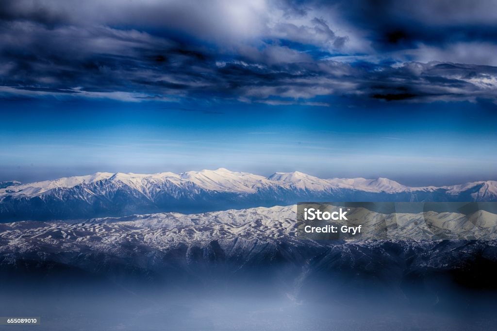 Mountain ranges of Macedonia seen from Sar /Sharr Mountains / Malet e Sharrit between Macedonia and Kosovo in winter Adventure Stock Photo