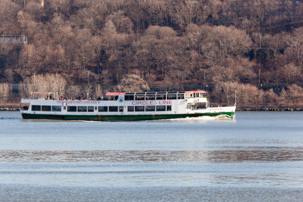 Circle Line Cruise Boat on Hudson River FORT LEE, NEW JERSEY - January 1, 2017: A Circle Line Cruise boat travels the Hudson River near the George Washington Bridge. gwb stock pictures, royalty-free photos & images