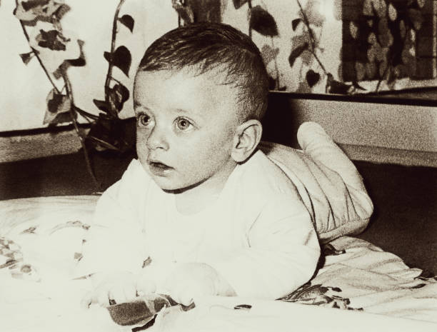 istock Vintage baby - grainy black and white 655101512