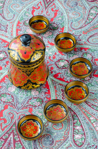 istock Russian traditional Khokhloma dishes on a red handkerchief 655103788