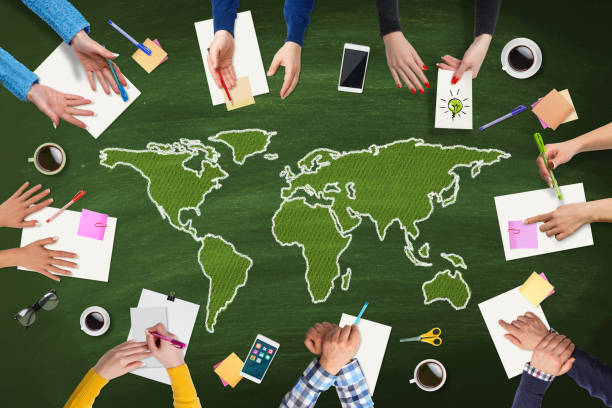 istock Business people meeting with Green World map on table 655108958