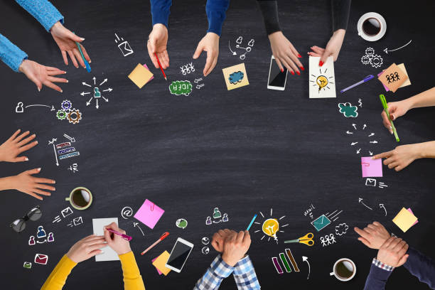 istock Business people group works at a blackboard table 655108978
