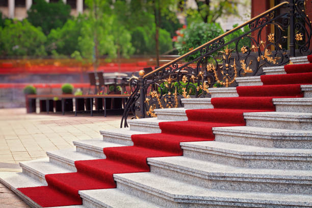 istock Red carpet on the staircase 655113148