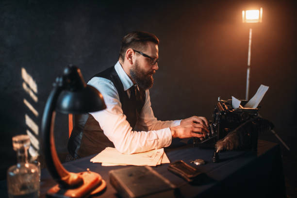 istock Literature author in glasses typing on typewriter 655113724