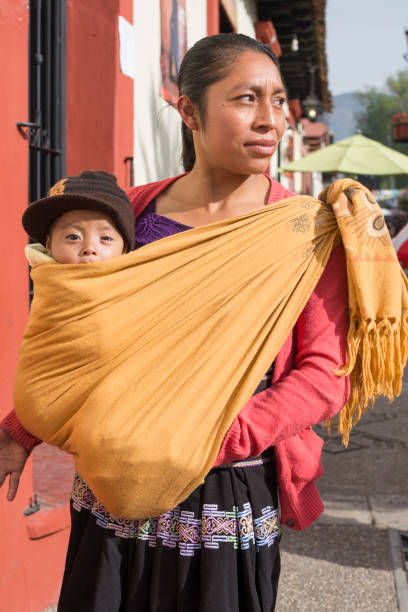 tsotsil woman carrying baby in shawl - india traditional culture indigenous culture women imagens e fotografias de stock