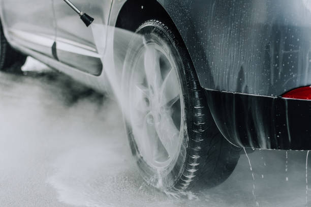 istock Cleaning Car Using High Pressure Water. Soft focus. Shallow DOF 655120324