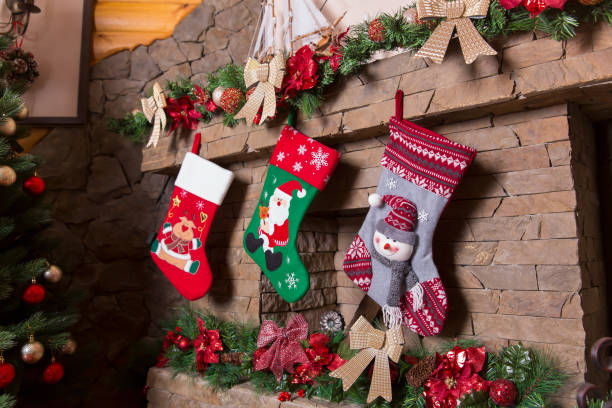 istock Stone fireplace decorated with christmas stockings 655123454