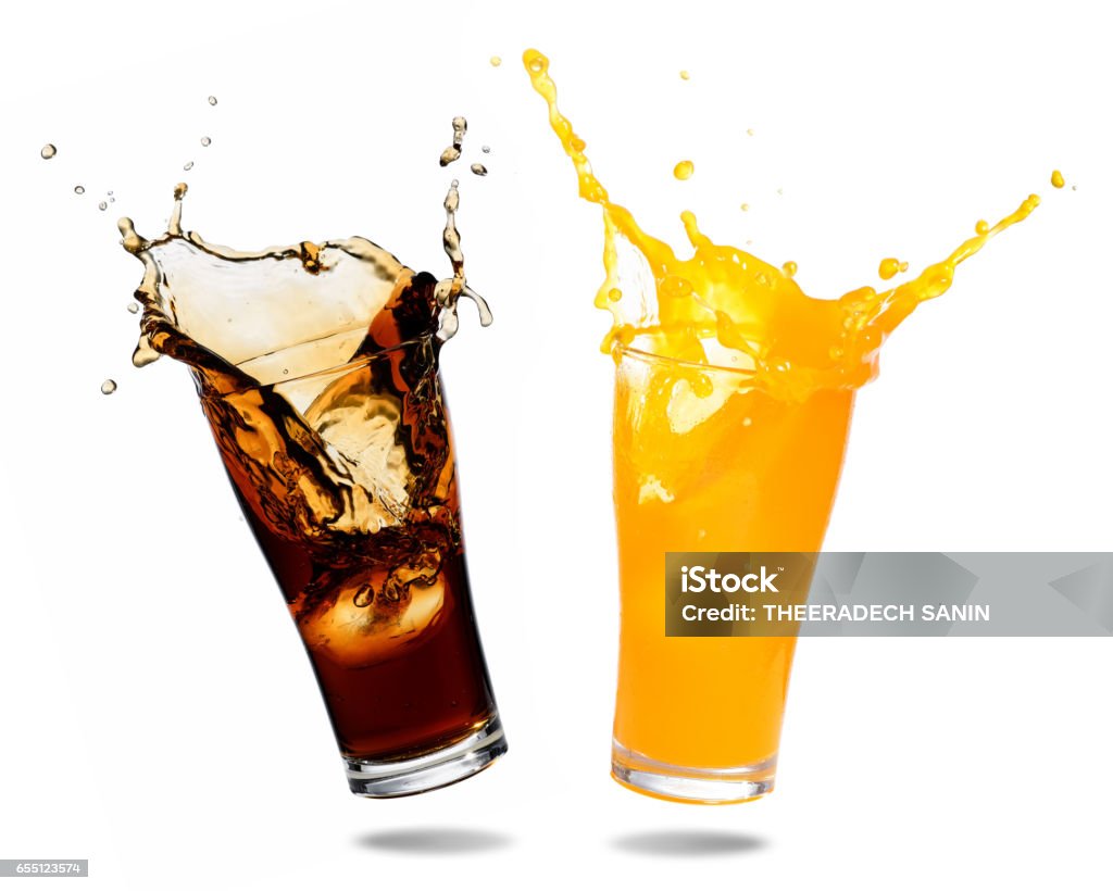 Soft drinks splashing Orange juice and cola splashing out of glass., Isolated white background. Soda Stock Photo