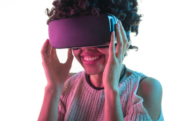 istock Woman smiling and adjusting VR headset 655137060