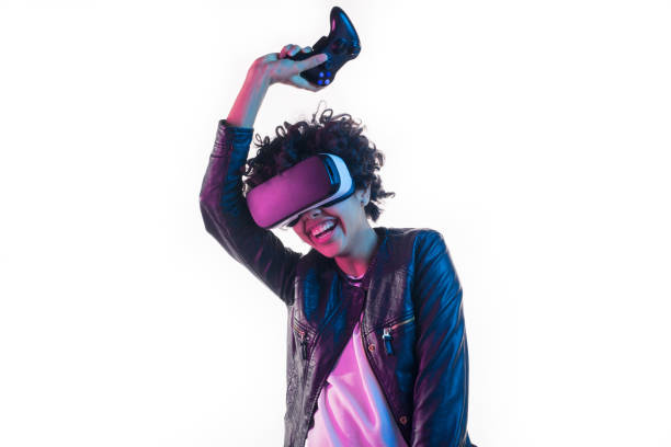 istock Woman with VR goggles and gamepad 655137108