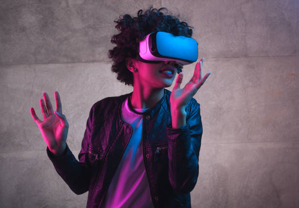 istock A girl playing with VR headset 655137196