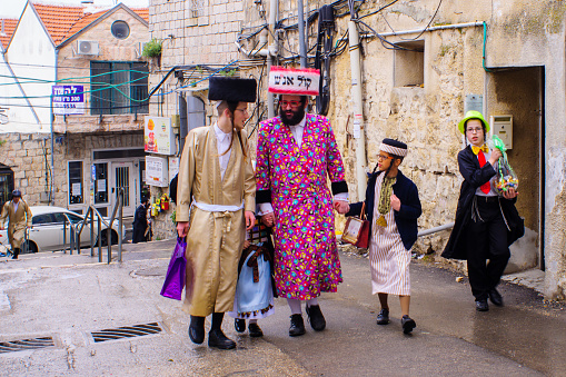 Jerusalem: Ultra-orthodox Jewish men, some in costumes, as part of a celebration of the Jewish Holyday Purim, in the Mea Shearim neighborhood, Jerusalem, Israel