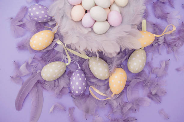 istock Easter Eggs in Nest on Purple Background 655140296
