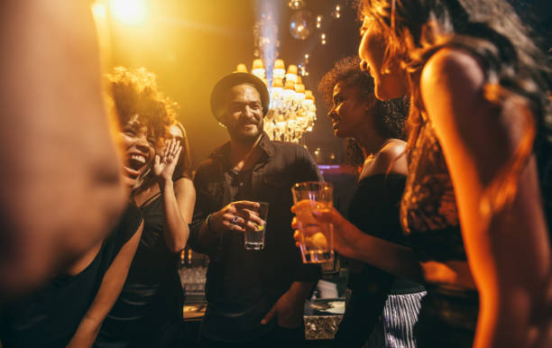 istock Group of friends enjoying a party at pub 655141164