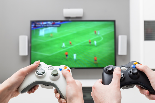 gaming game play tv fun gamer gamepad guy controller video console playing player holding hobby playful enjoyment view concept - stock image