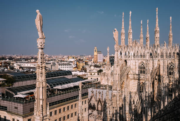 istock Numerous steeples with statues on Duomo di Milano main Cathedral 655147406