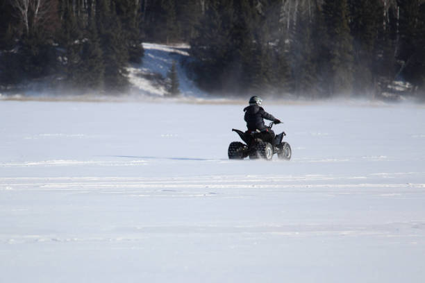 istock Driving a Quad in Winter 655147450