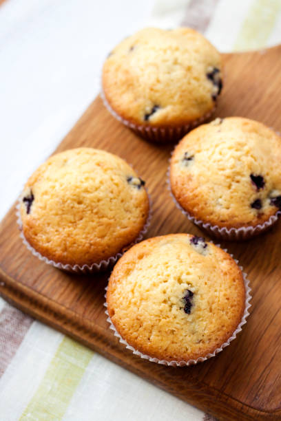 istock Homemade muffins with blueberries on a wooden board 655150302