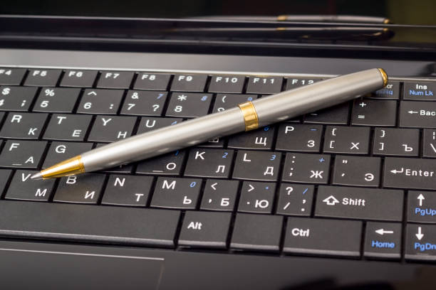 istock Electronic collection - laptop keyboard with pen 655153186