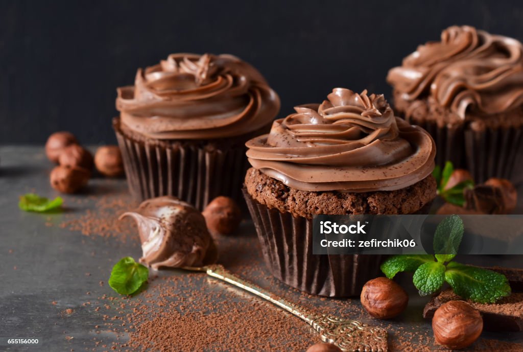 Chocolate cupcakes with peanut paste the old grunge background Cupcake Stock Photo
