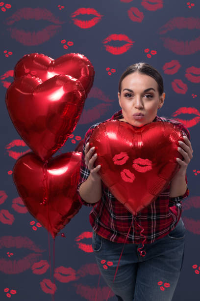 istock Young beautiful girl sending kiss 655159352
