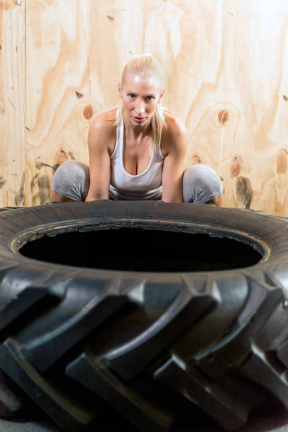 istock Fit young Woman Doing Exercise With Tire 655159936