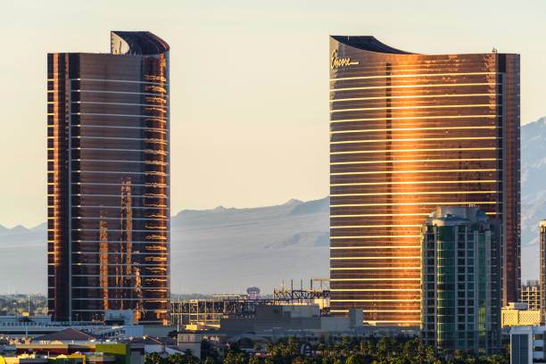 Las Vegas Hotel Casino Buildings at sunset Las Vegas, USA - March 16,2017: Telephoto shot of Buildings of Las Vegas Hotel & Casino buildings at sunset. Las Vegas is one of the most popular travel destinations in the world and famous for entertainment and live  night show. Located about 5 hours east of Los Angeles. wynn las vegas stock pictures, royalty-free photos & images