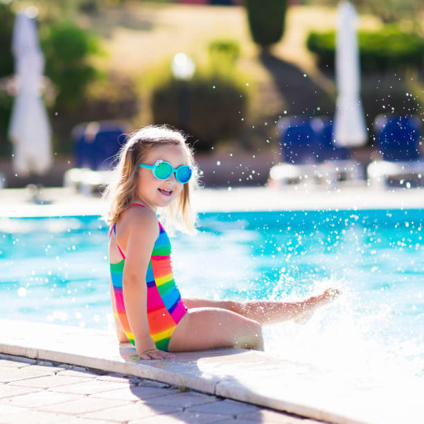 istock Child in swimming pool on summer vacation 655165210
