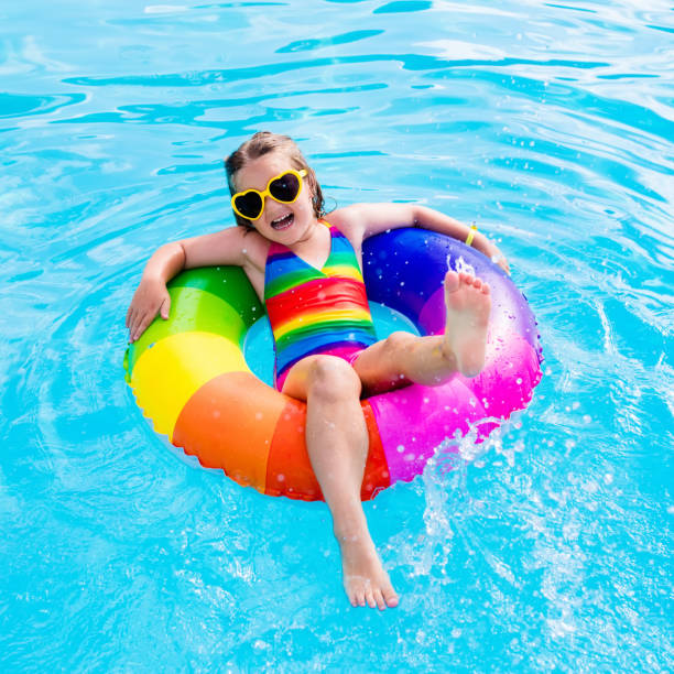 istock Child with toy ring in swimming pool 655165322