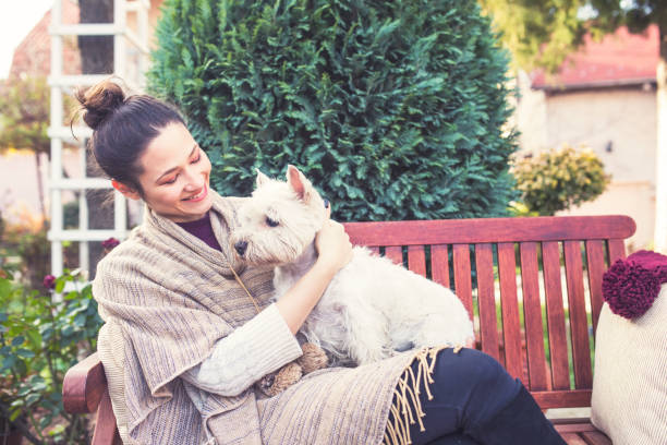 istock Beautiful young woman with dog 655165360