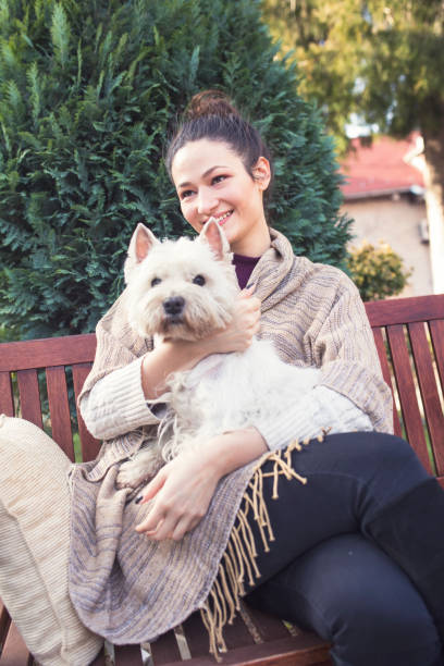 istock Beautiful young woman with dog 655165378