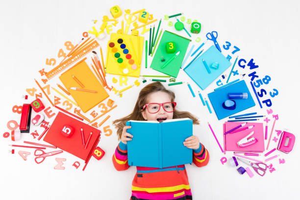 istock Child with school and drawing supplies. Student with book. 655165508